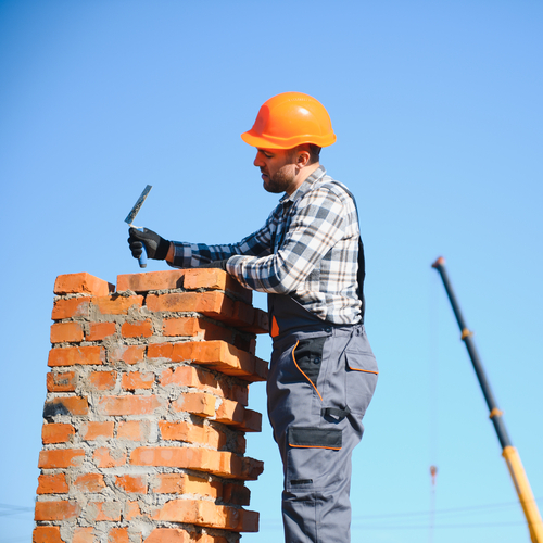 roofer repairing a chimney