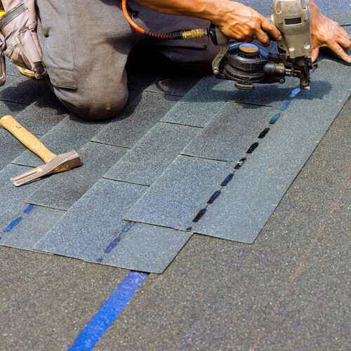 commercial roof being repaired