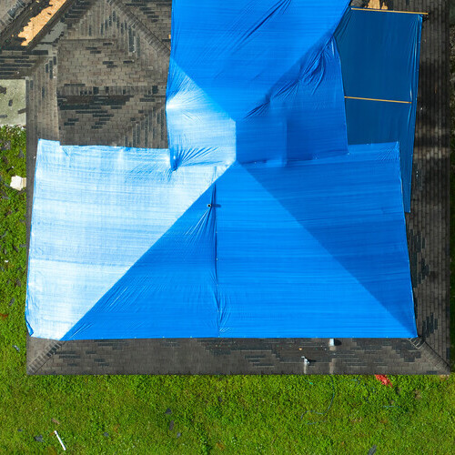 tarped roof for emergency roofing on a home