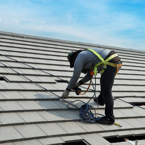 synthetic tile roofing being applied to a home